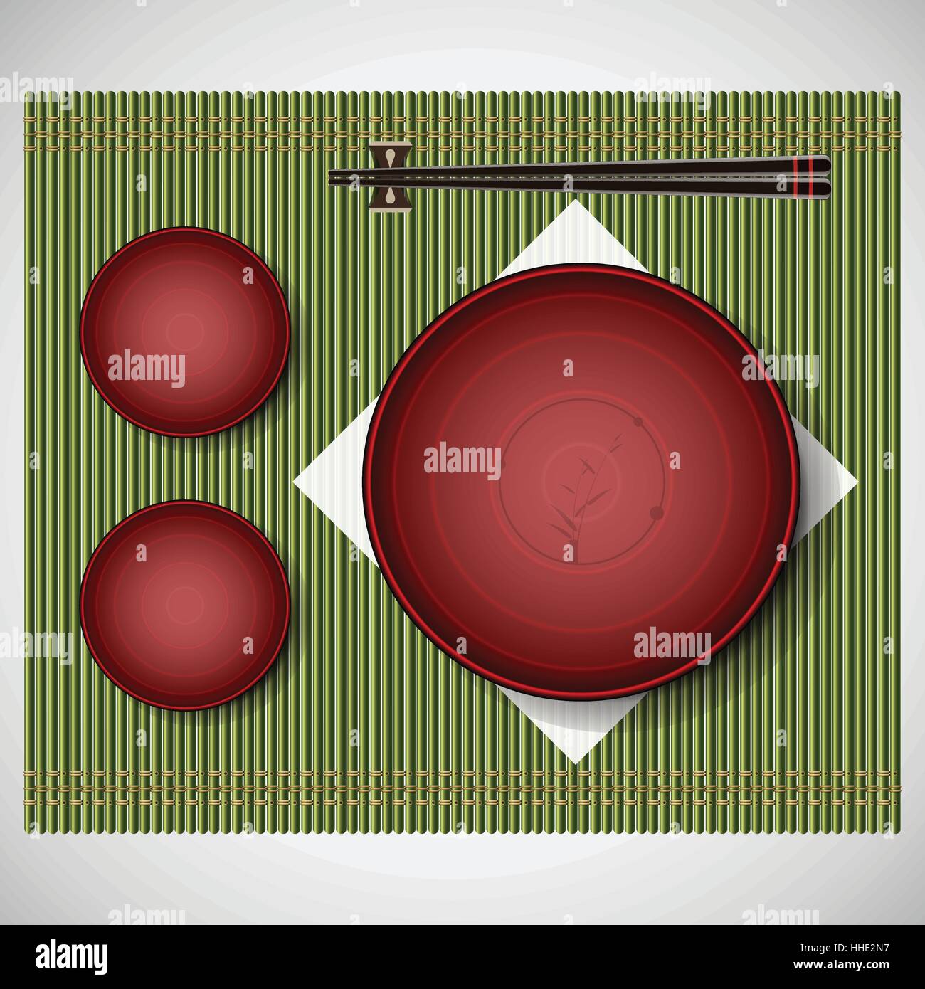 Bamboo mat with plates and chopsticks setting for lunch traditional