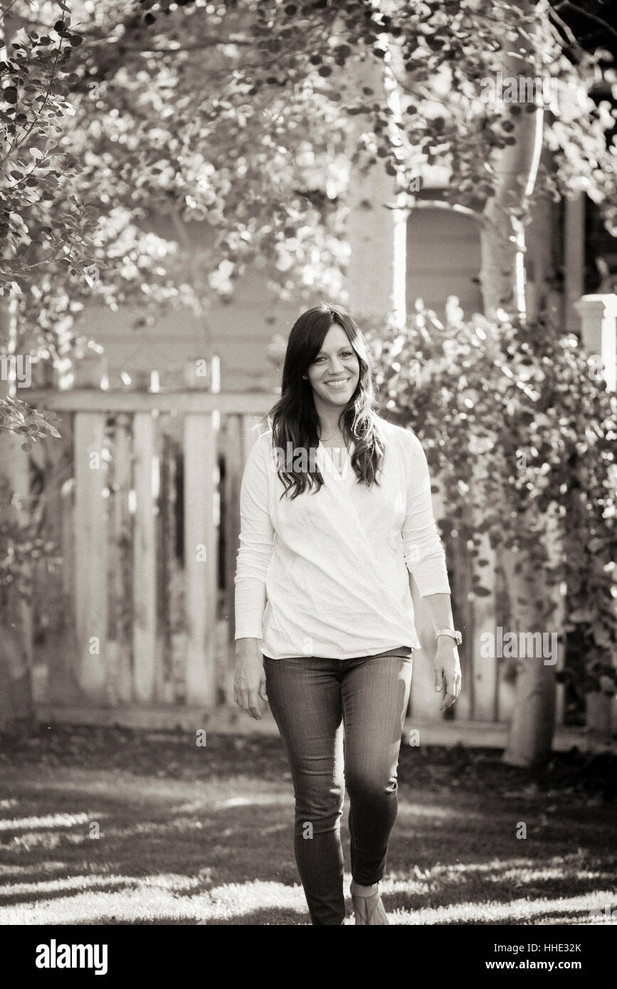 Woman walking along the road hi-res stock photography and images - Alamy