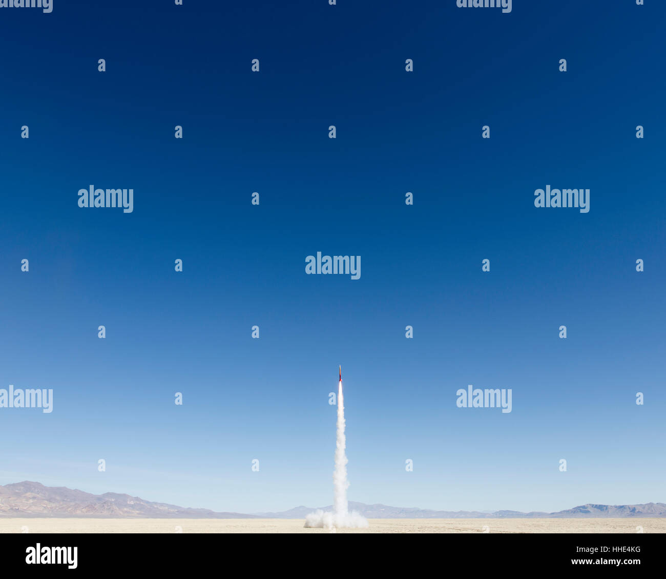 Rocket shooting into vast, desert sky, Black Rock Desert, Nevada Stock Photo
