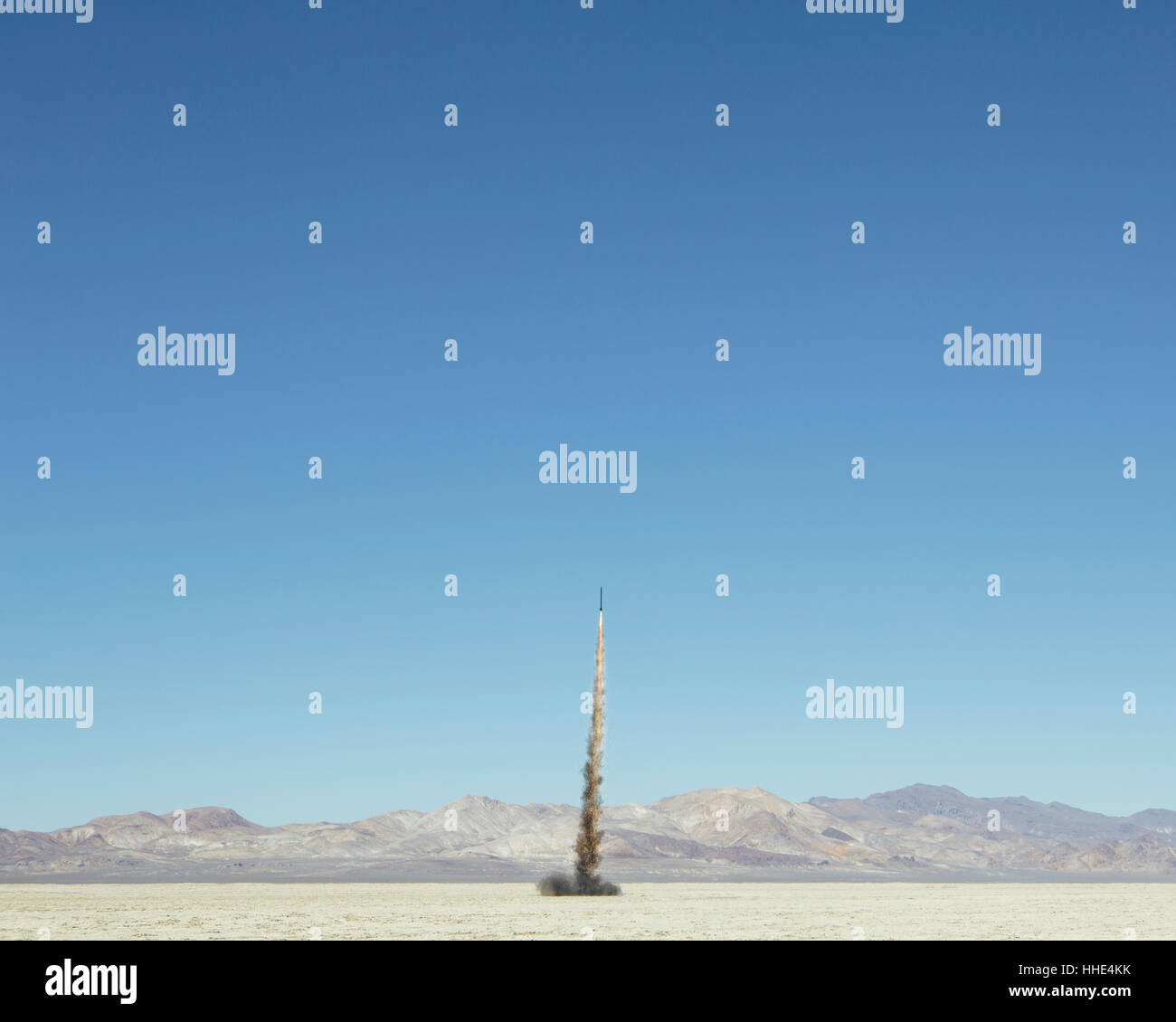 Rocket shooting into vast, desert sky, Black Rock Desert, Nevada Stock Photo