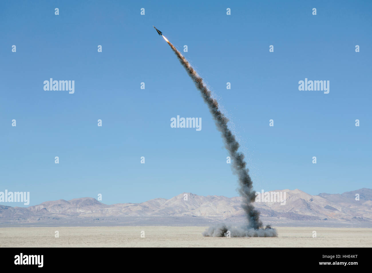 Rocket shooting into vast, desert sky, Black Rock Desert, Nevada Stock Photo