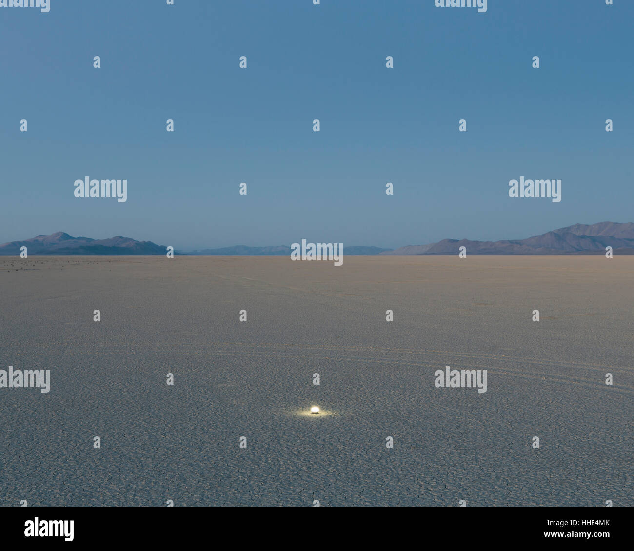 Small glowing light on vast playa, Black Rock Desert, Nevada Stock Photo