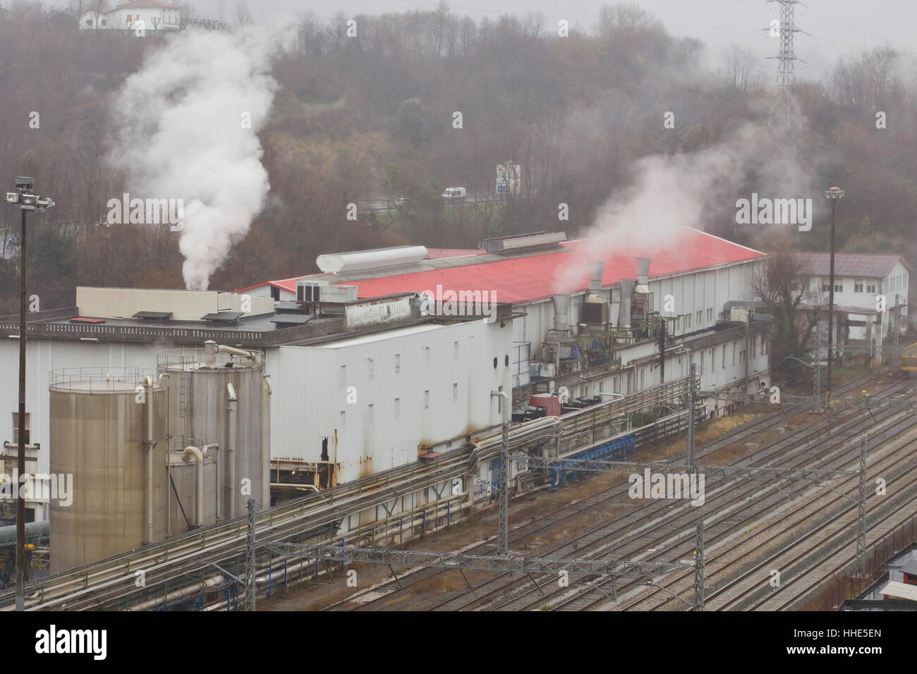 Pollution from industrial building . Stock Photo