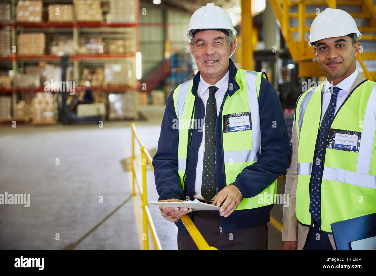 Portrait confident manager and worker in distribution warehouse Stock Photo