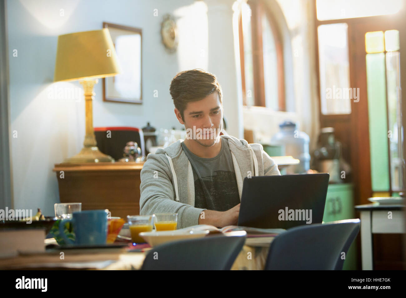 Young man college student studying at laptop Stock Photo