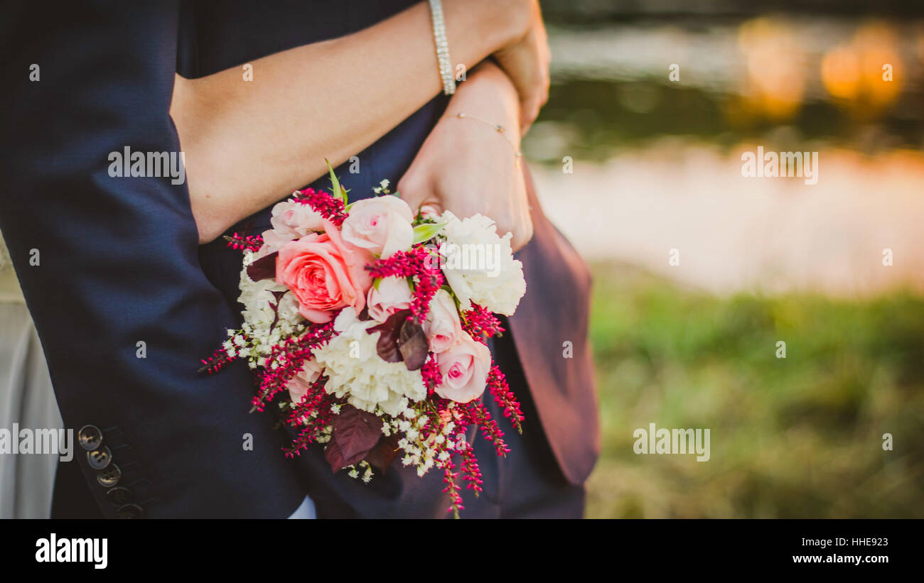 A couple hold beautiful flowers Stock Photo