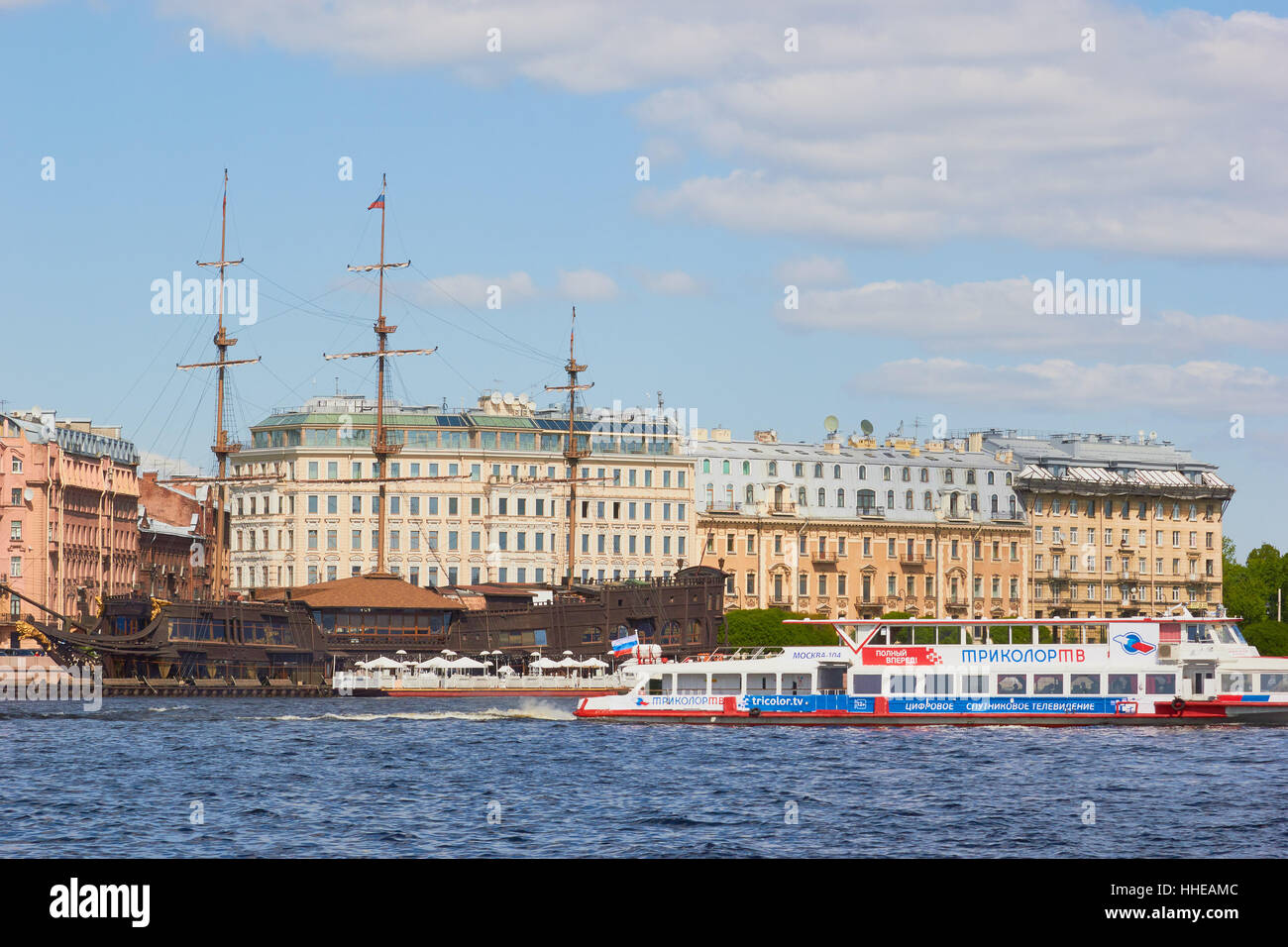 Restaurant ship the Flying Dutchman moored on the river Neva and river cruise boat St Petersburg Russia Stock Photo