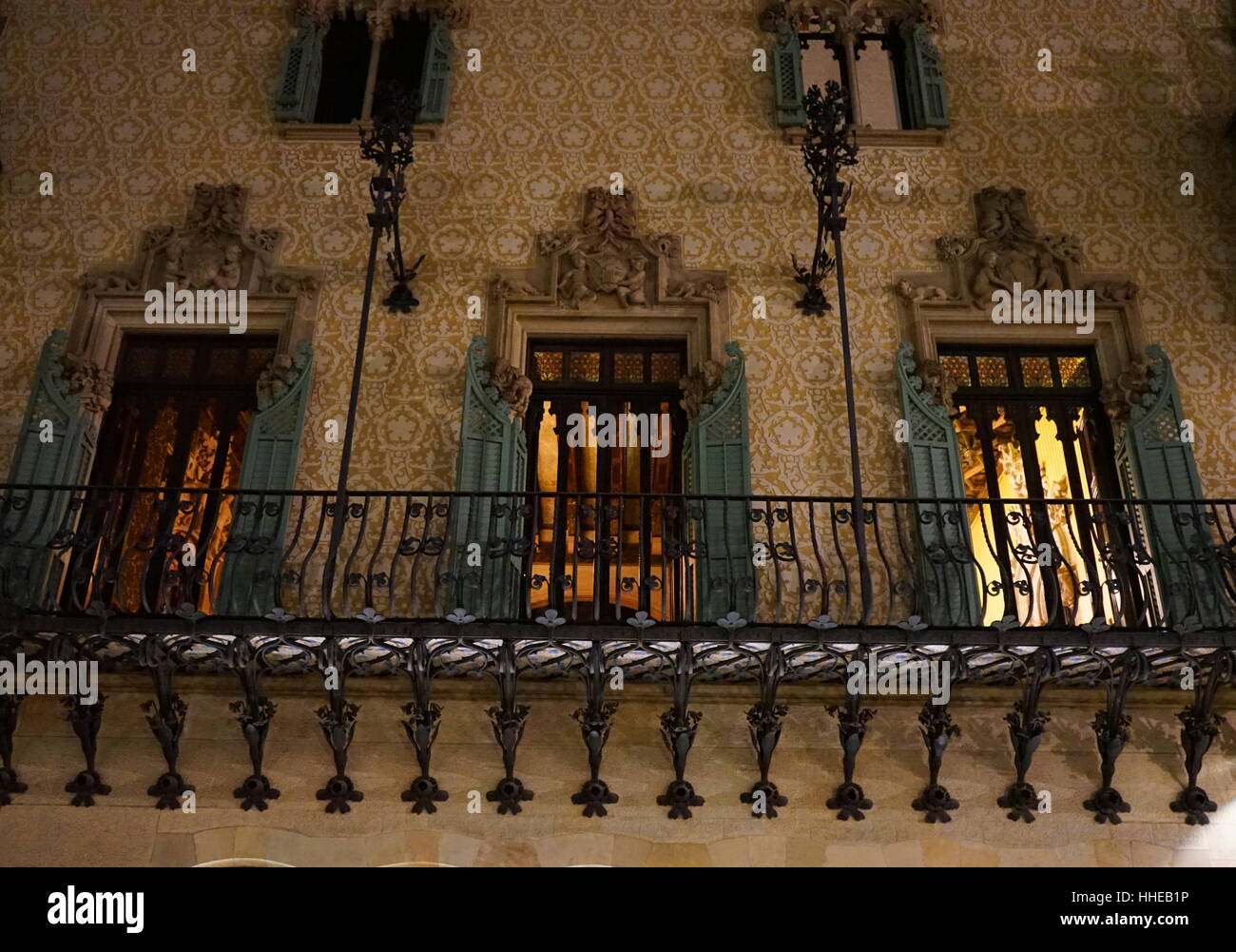 Casa Amatller, a building in the Modernism style in Barcelona, designed by Josep Puig i Cadafalch. Balcony of the Casa Amatller in Barcelona. The stairs on the right, in front of the large set of stained glass doors, lead to the stair court. Stock Photo