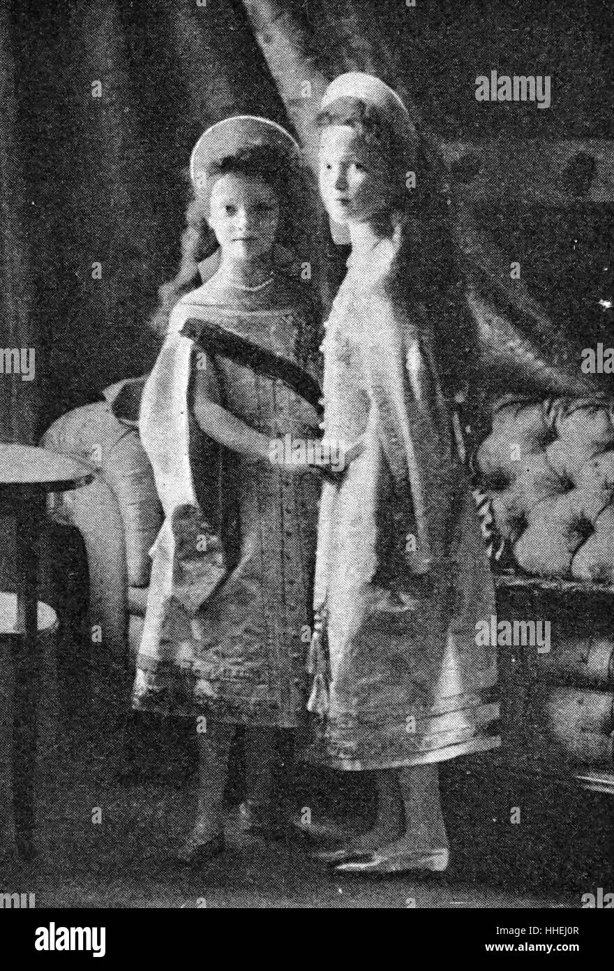 Photographic portrait of the Grand Duchess Olga Nikolaevna of Russia (1895-1918) and Grand Duchess Tatiana Nikolaevna of Russia (1897-1918) the two eldest children of Nicholas II of Russia, in their Christening robes. Dated 20th Century Stock Photo