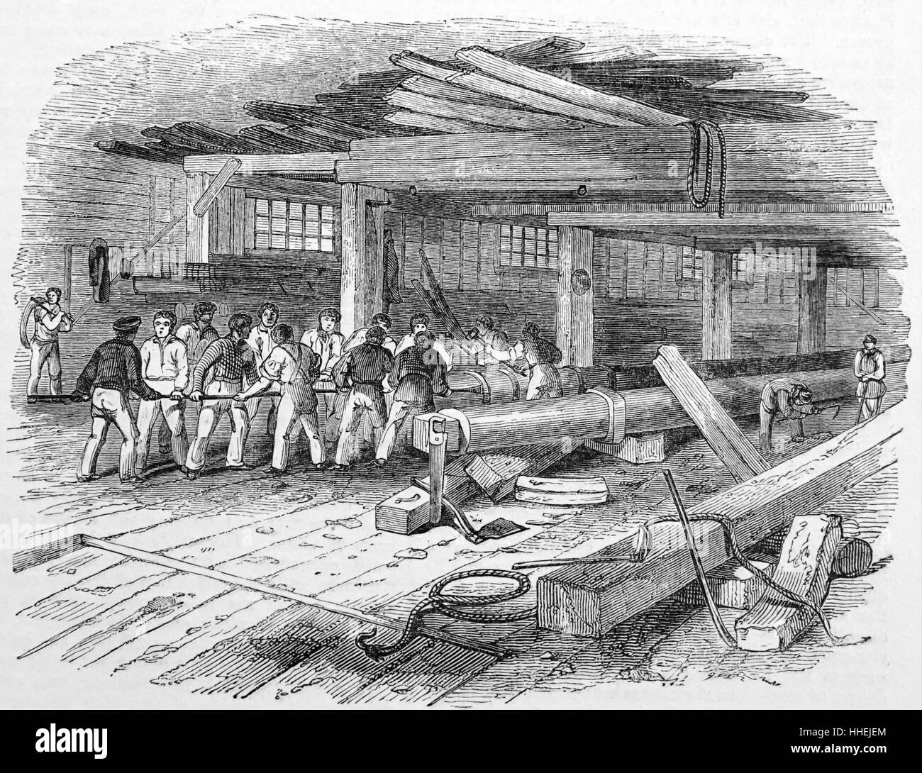 Interior view of a mast house: 'hooping' or driving iron rings onto the mast. Dated 19th Century Stock Photo