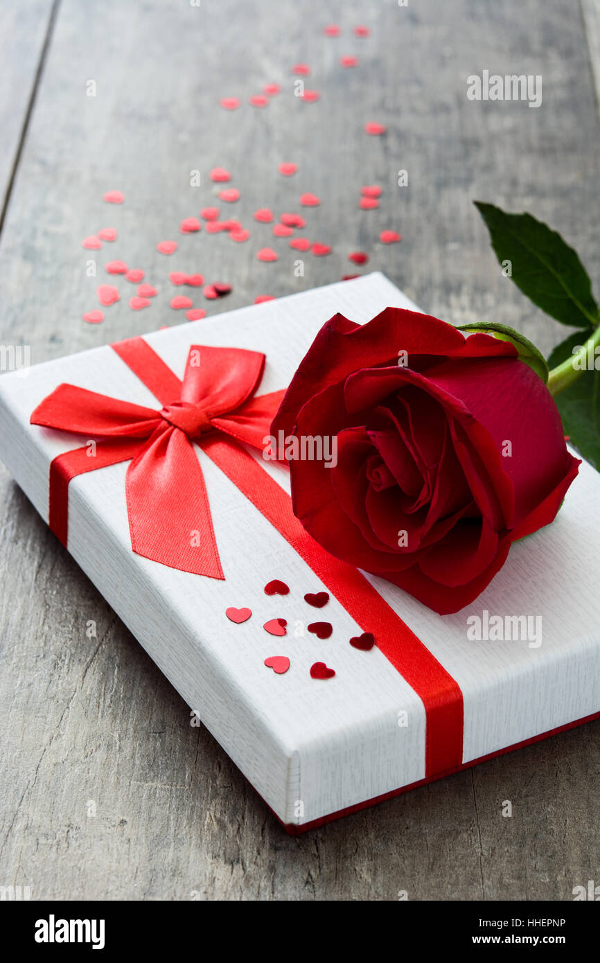 Gift box and red rose on wooden background.Valentines concept Stock ...