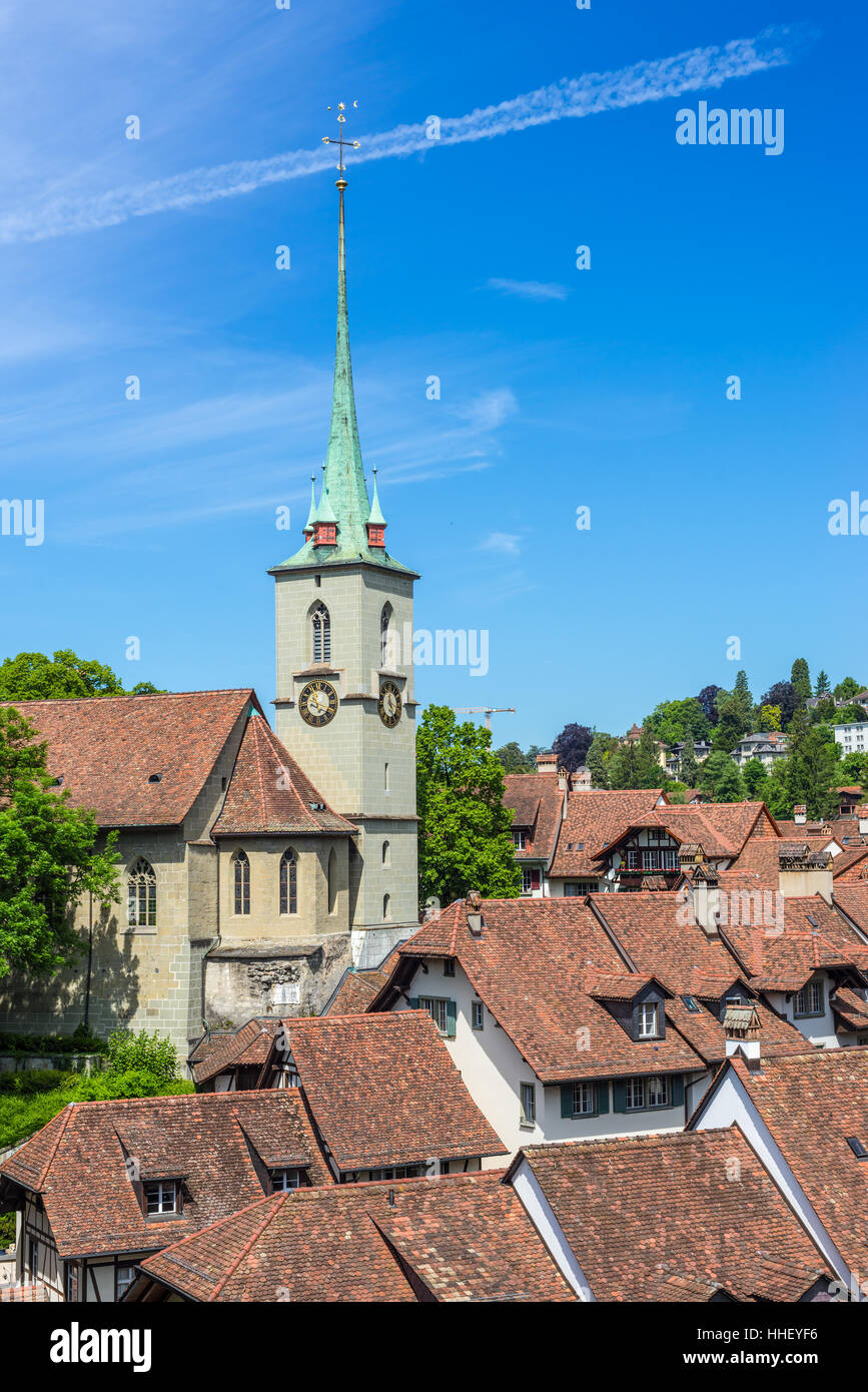 Bern cityscape. Swiss capital city. Nydeggkirche (Nydegg Church) and tiled rooftops. Stock Photo