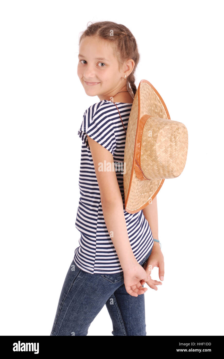 Pretty twelve year old girls wearing a big floppy straw sun hat