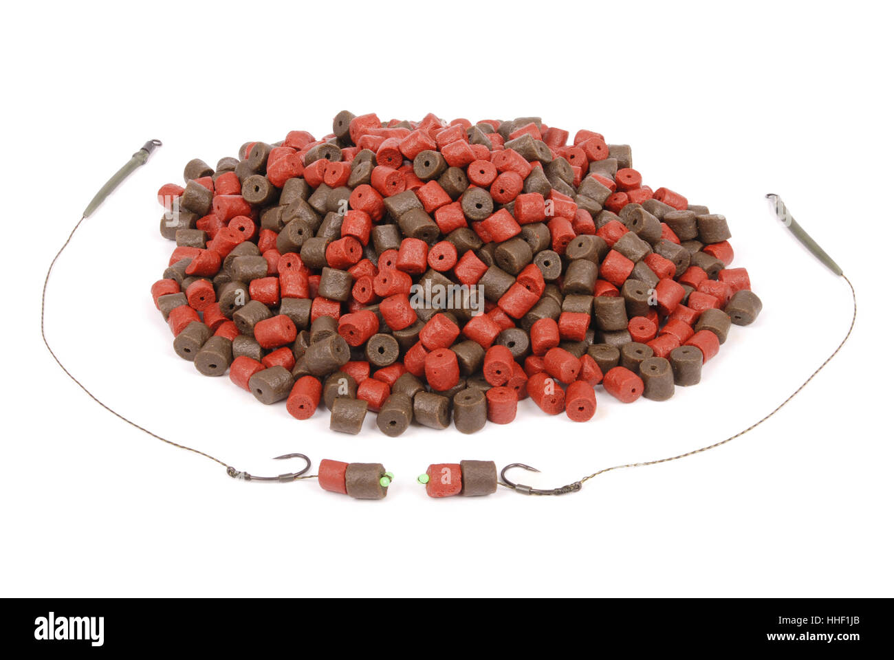 https://c8.alamy.com/comp/HHF1JB/fishing-bait-with-hook-and-brown-with-red-pre-drilled-halibut-pellets-HHF1JB.jpg