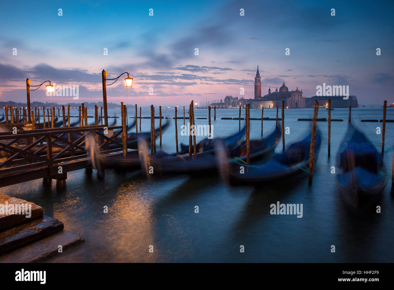 Pre-dawn light over gondolas and San Giorgio Maggiore, Venice, Veneto, Italy Stock Photo