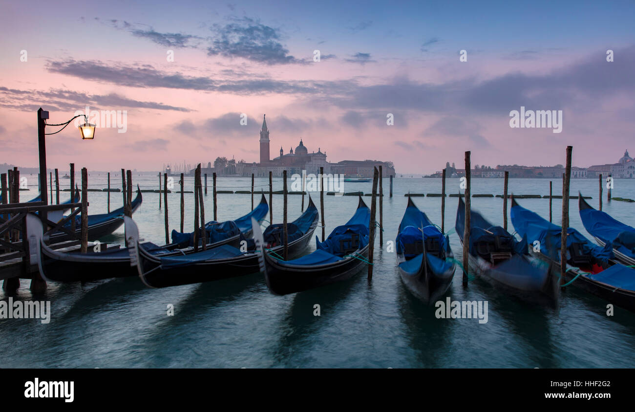 Pre-dawn light over gondolas and San Giorgio Maggiore, Venice, Veneto, Italy Stock Photo