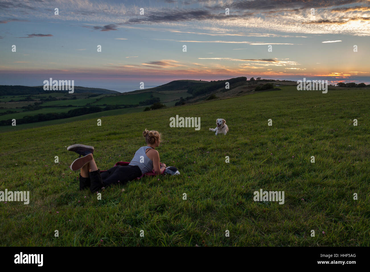Girl watching sunset hi-res stock photography and images - Alamy