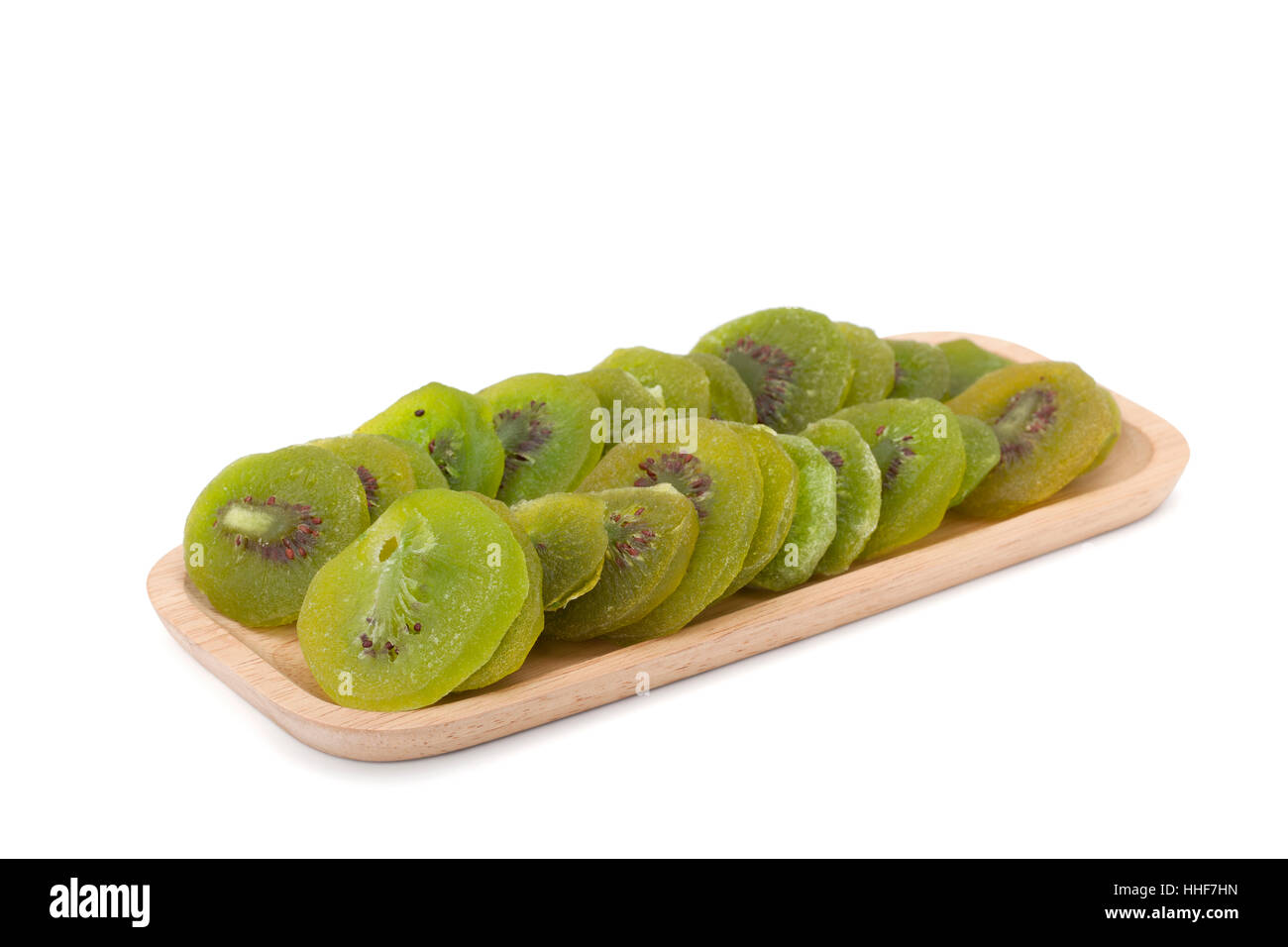 kiwi dried fruit in woodenware isolated on white background with clipping path Stock Photo
