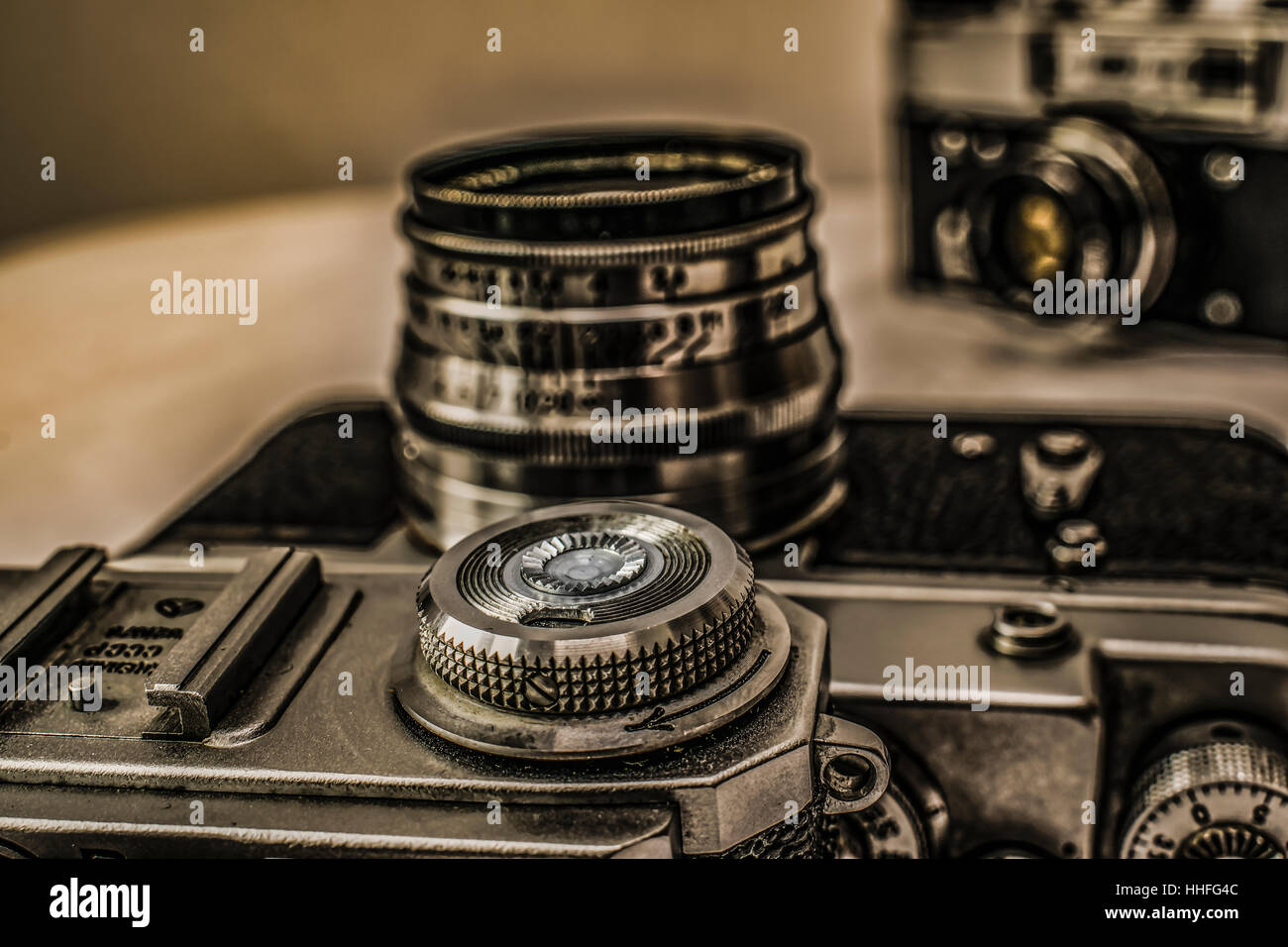Old Russian classic analog film cameras with manual controls on dirty canvas with vintage look Stock Photo