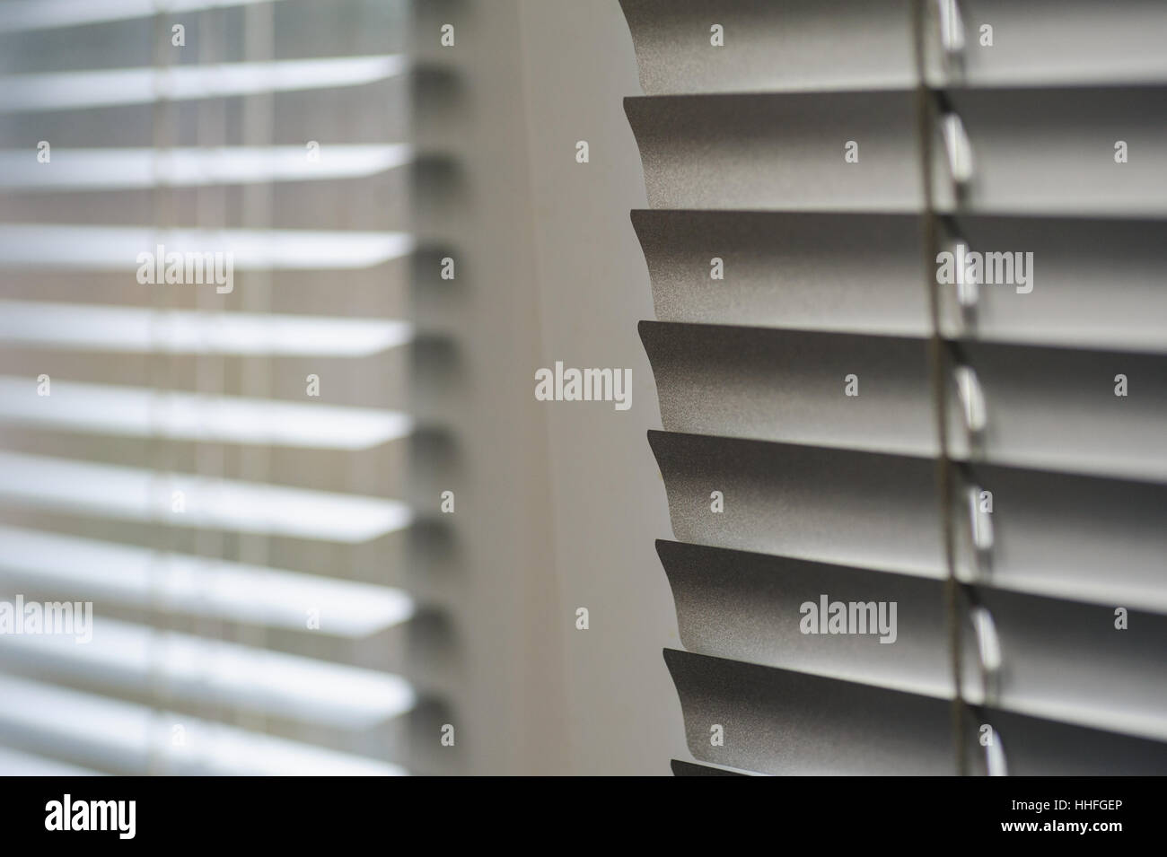 White shutters on the window in the Office Stock Photo