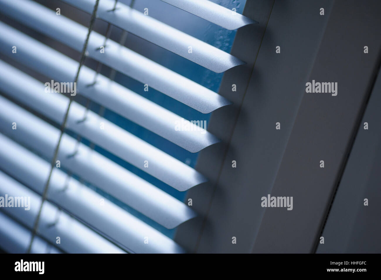 White shutters on the window in the Office Stock Photo