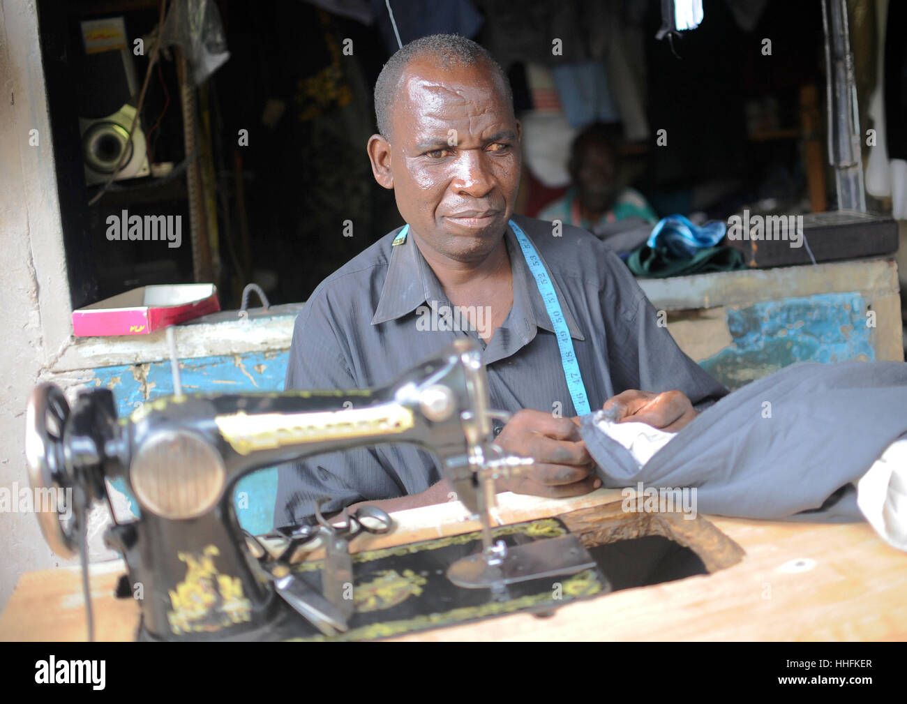 Lusaka, Zambia. 9th Mar, 2016. A tailor works in the compound Chawama of Lusaka, Zambia, 9 March 2016. Photo: Britta Pedersen/dpa-Zentralbild/ZB/dpa/Alamy Live News Stock Photo