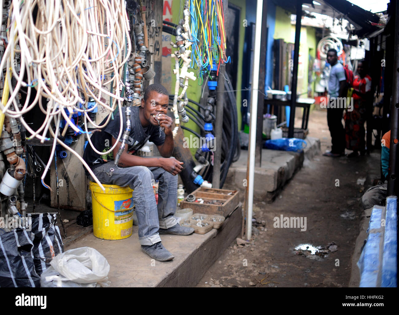 Lusaka, Zambia. 9th Mar, 2016. A sits in front of his shop in the compound Chawama of Lusaka, Zambia, 9 March 2016. Photo: Britta Pedersen/dpa-Zentralbild/ZB/dpa/Alamy Live News Stock Photo