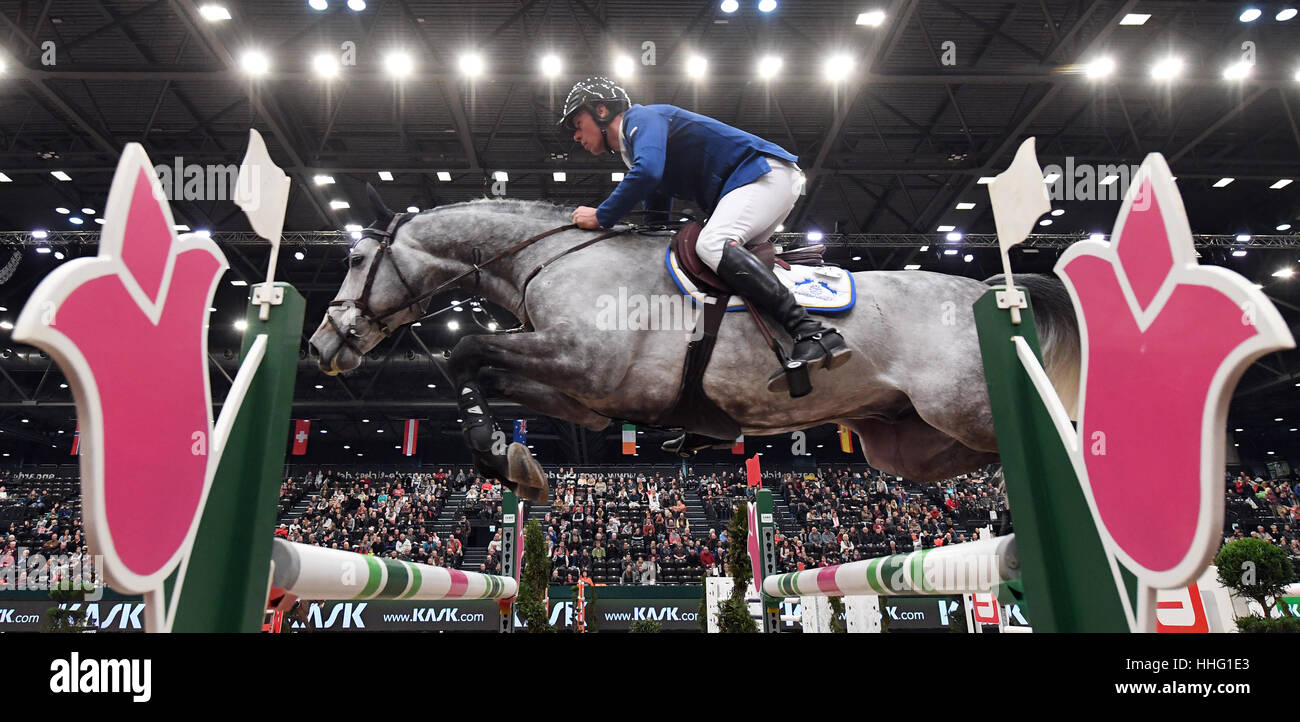 Leipzig, Germany. 19th Jan, 2017. German show jumper Christian Ahlmann and horse Clintrexo Z in action during the 'Kask Youngster Cup' of the 'Partner Pferd' (lit. 'Partner Horse') fair in Leipzig, Germany, 19 January 2017. The fair continues until Sunday, 22 January 2017. Highlight will be the finale in the Jumping World Cup. Photo: Hendrik Schmidt/dpa-Zentralbild/dpa/Alamy Live News Stock Photo