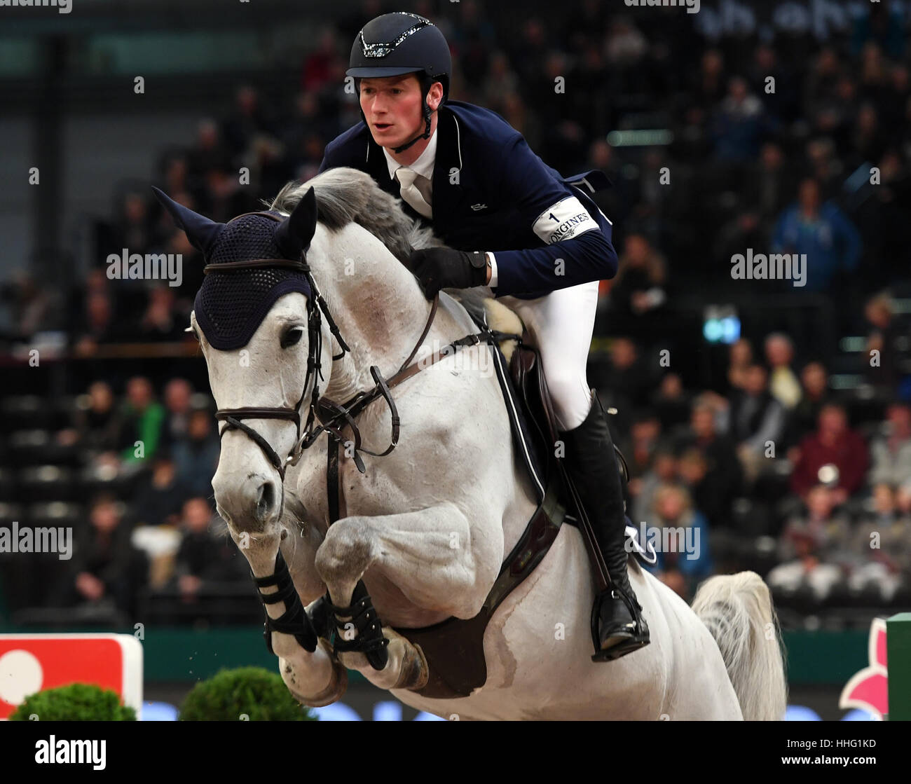 Leipzig, Germany. 19th Jan, 2017. German show jumper Daniel Deusser and his horse Zaia di San Giovanni in action during the 'Kask Youngster Cup' of the 'Partner Pferd' (lit. 'Partner Horse') fair in Leipzig, Germany, 19 January 2017. The fair continues until Sunday, 22 January 2017. Highlight will be the finale in the Jumping World Cup. Photo: Hendrik Schmidt/dpa-Zentralbild/dpa/Alamy Live News Stock Photo