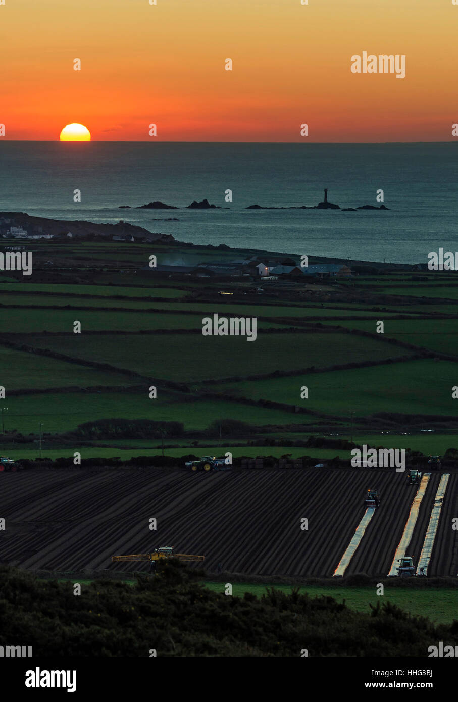 Cornwall, UK. 19th Jan, 2017. Clear winter skies allow for another stunning sunset at Lands End in Cornwall with the Longships Lighthouse in deep shadow Credit: Bob Sharples/Alamy Live News Stock Photo