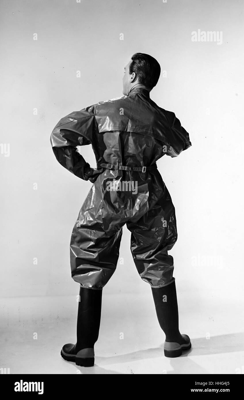 Terylene' a heavy suit worn by workers handling products at an oil refinery. Made by the R.F.D. The work suit is coated in P.V.C which lasts longer than more conventional garments. Stock Photo