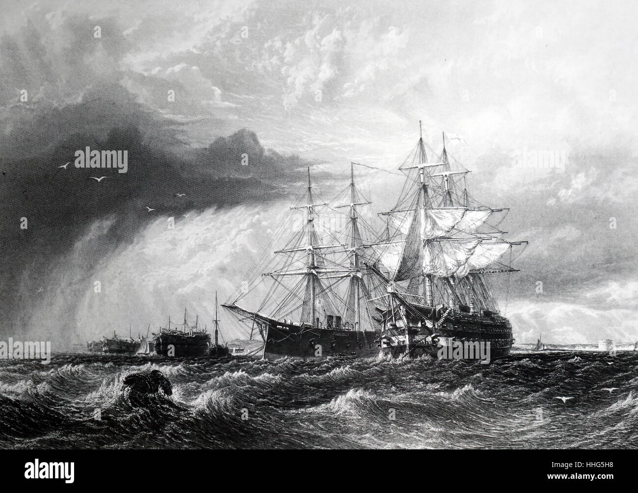 Warships at anchor at the mouth of the Thames awaiting the tide. The vessel on the right is a sailing vessel while the one next to her is transitional with steam and sail. On the left are convict hulks used as prison accommodation. Engraving by Arthur Willmore (1814-1888). Stock Photo