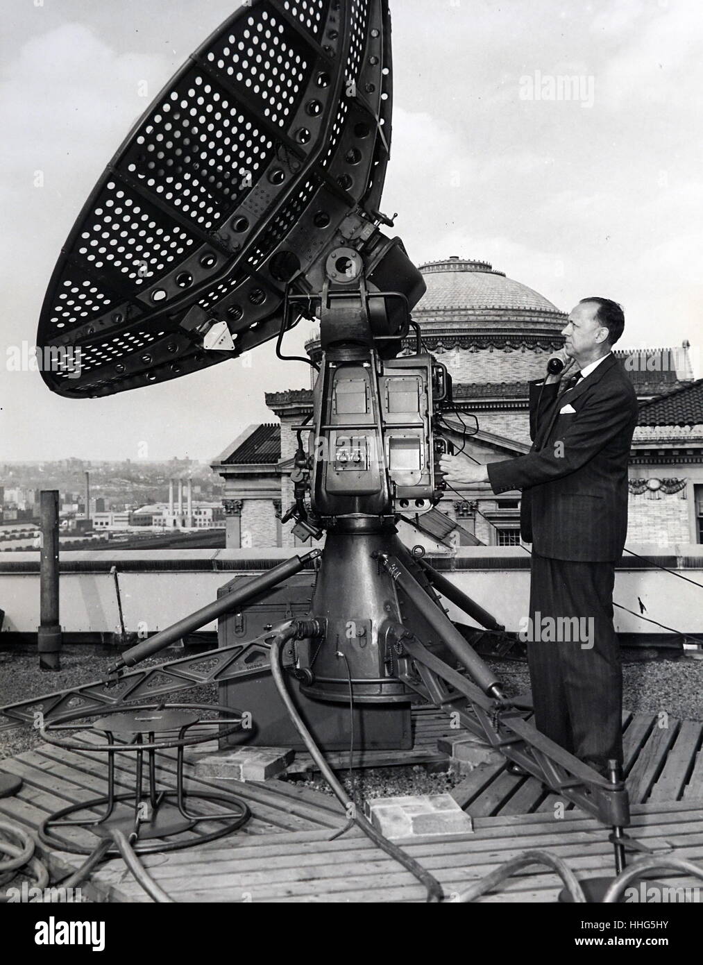 Dr. Serge A. Korff, well known cosmic ray physicist of New York University, telephones instruction from Rawin antenna being tested for later use in cosmic ray balloons flights Stock Photo