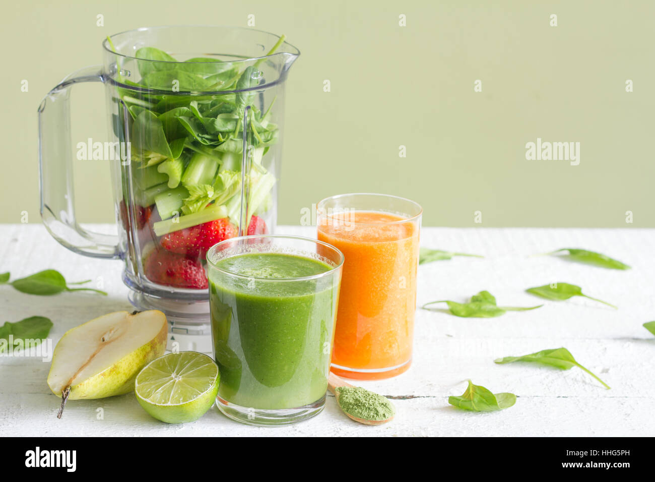 Green smoothie with blender and fruits health diet lifestyle concept Stock Photo