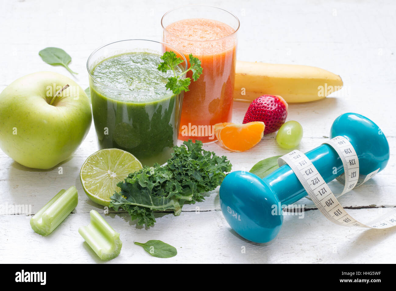 Fruits, vegetables, juice, smoothie and dumbbell health diet and fitness lifestyle concept Stock Photo