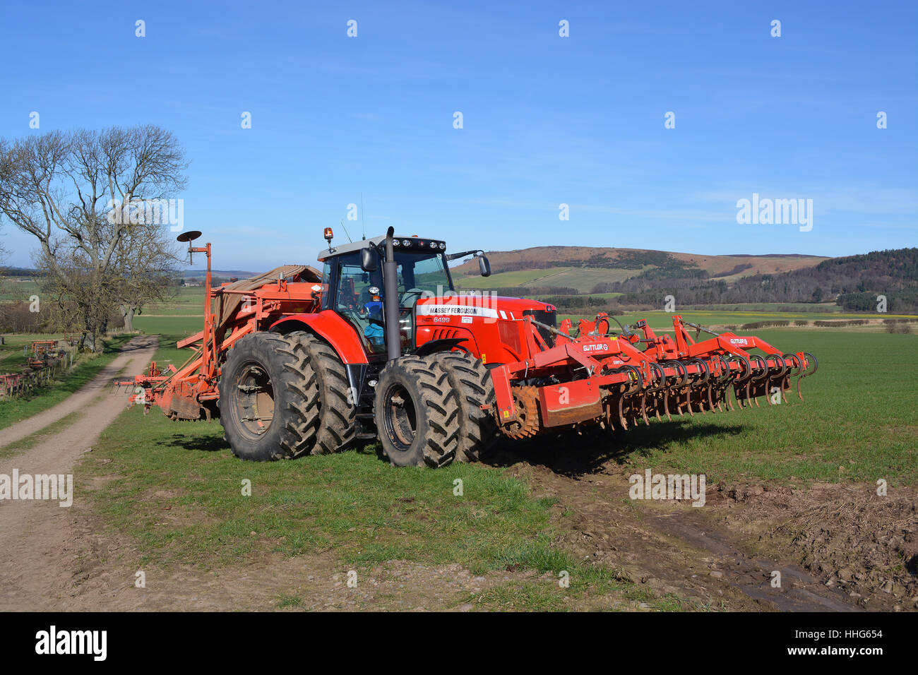 Massey Ferguson 6499 tractor and seed drill - Stock Image