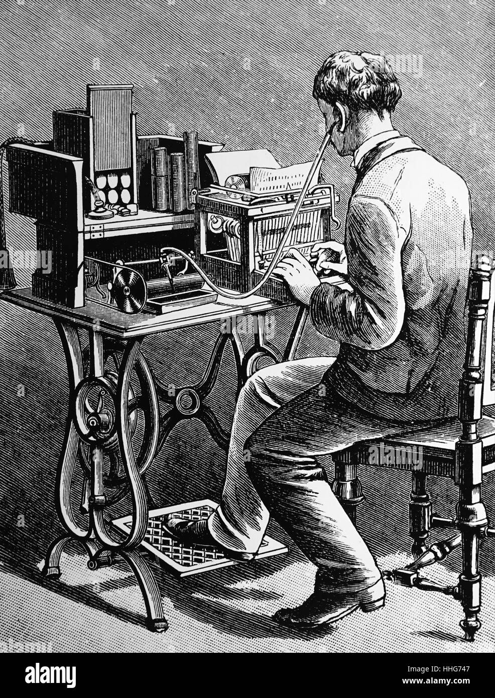 Audio-typing from a wax cylinder made on a Bell & Tainter Graphophone.The cylinder was rotated by means of a treadle underneath the stand. Stock Photo