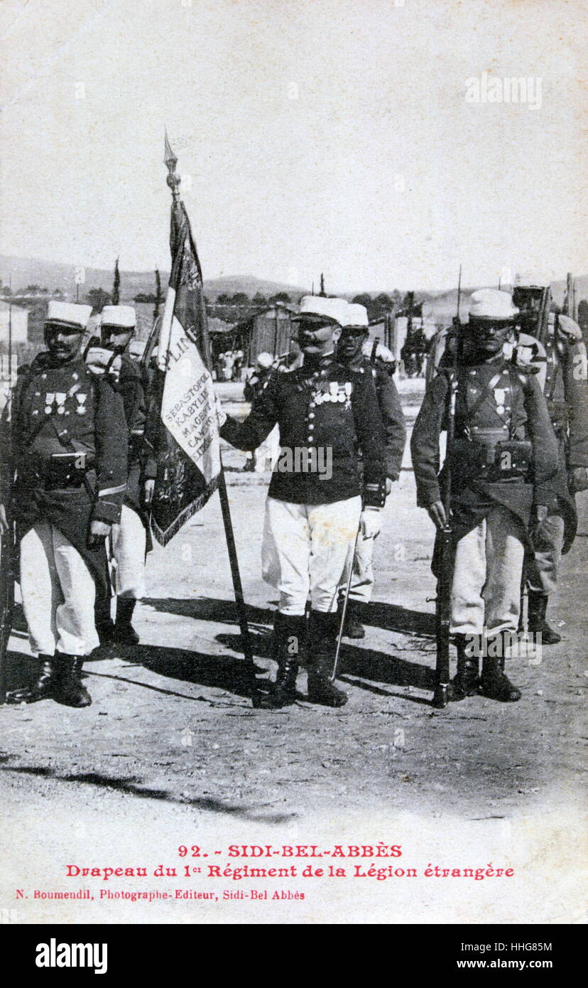 Sidi Bel Abbes, Algeria during French colonial rule. Flag ceremony by the French Foreign Legion. the city was closely associated with the French Foreign Legion, the location of its basic training camp, and the headquarters of its 1st Foreign Regiment. Stock Photo