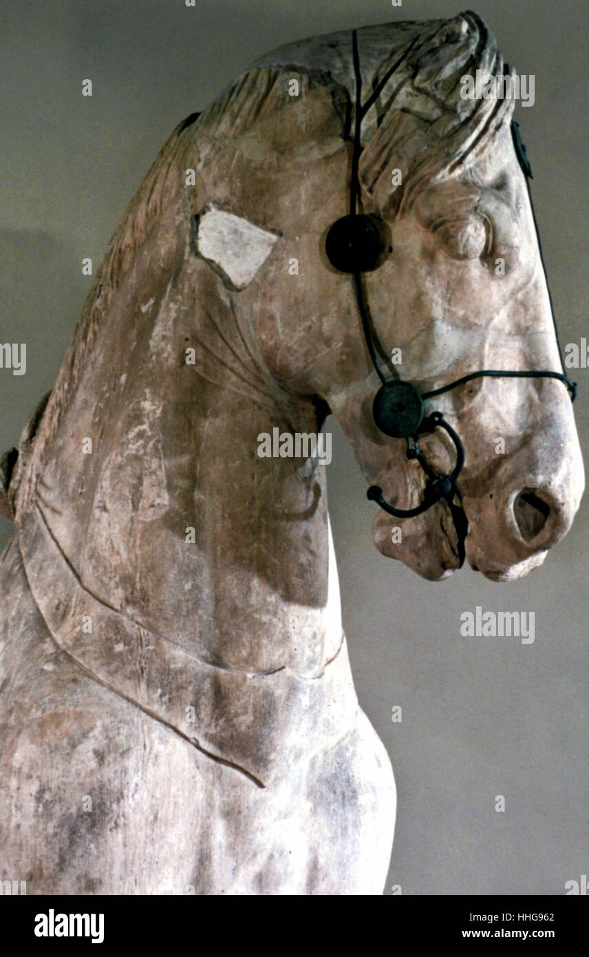 A fragmentary horse from a colossal four-horse chariot group which topped the podium of the Mausoleum at Halicarnassus. The Mausoleum at Halicarnassus or Tomb of Mausolus was a tomb built between 353 and 350 BC at Halicarnassus (present Bodrum, Turkey) for Mausolus, a satrap in the Persian Empire, and his sister-wife Artemisia II of Caria. The structure was designed by the Greek architects Satyros and Pythius of Priene Stock Photo