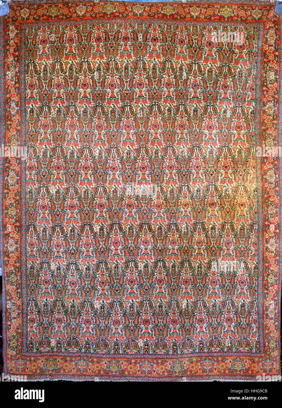 Islamic art: carpet from Persia (Iran), late 19th century, contains detailed fleurette patterns (Senneh work). Stock Photo