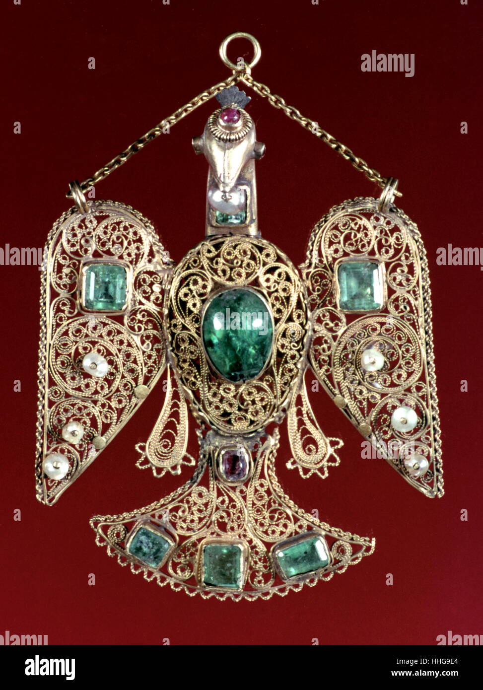 An enamelled and gem set gold, eagle pendant, Islamic possibly north