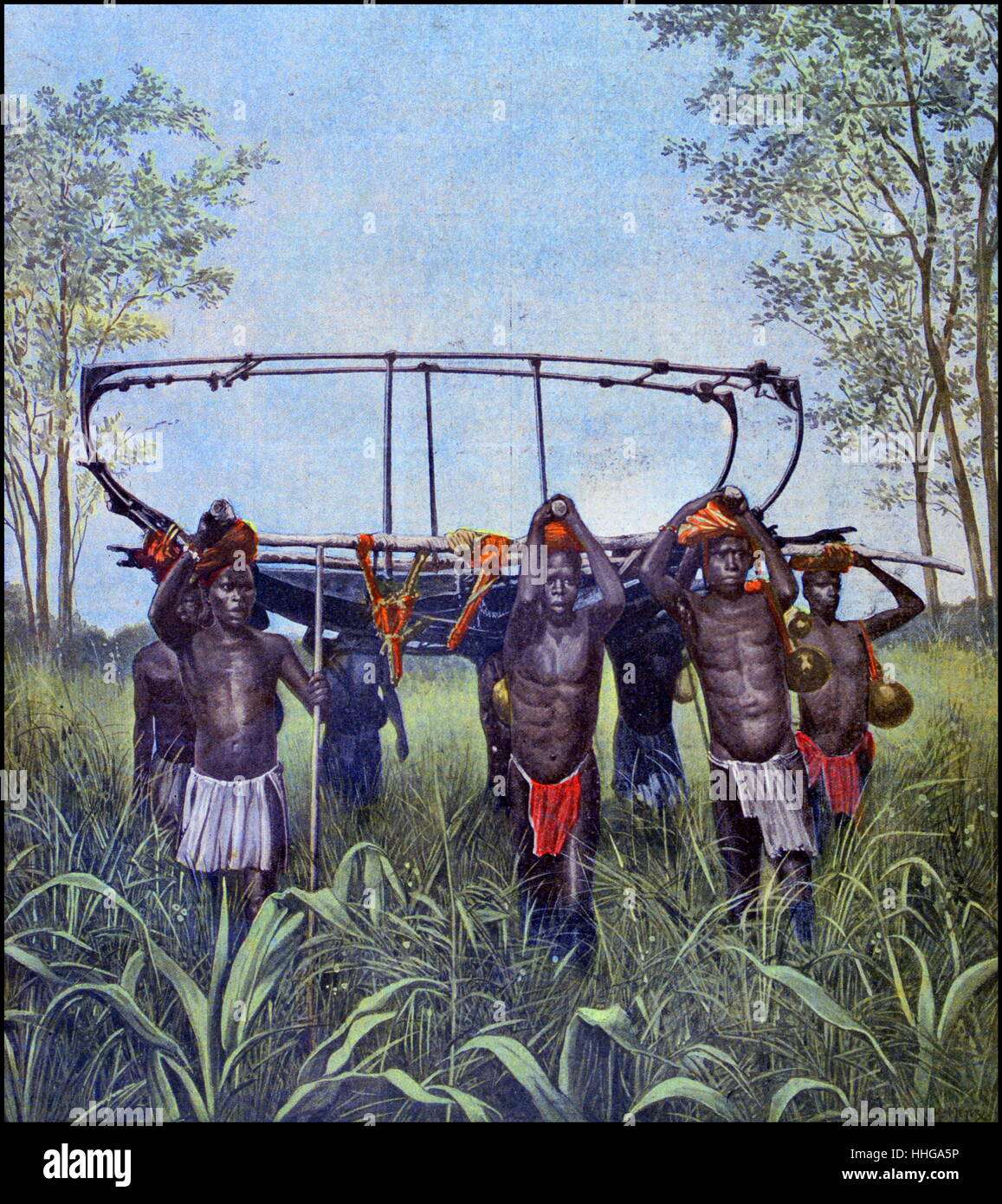 Native bearers carry equipment across central Africa for Colonel Jean-Baptiste Marchand (2 November 1863 – 13 January 1934) a French military officer and explorer in Africa. Stock Photo