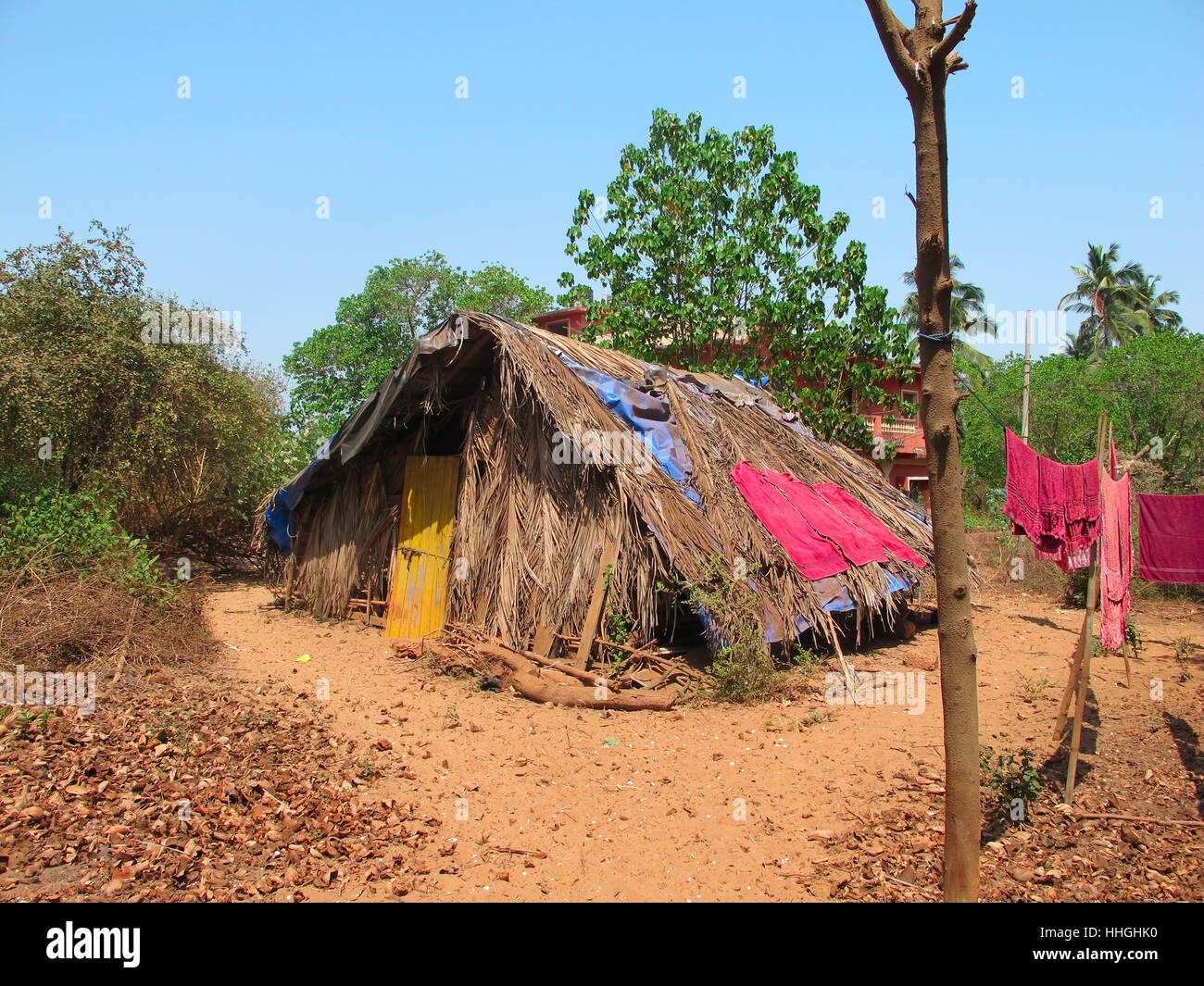 Poor indian house on the ocean beach. Slum poor Stock Photo - Alamy