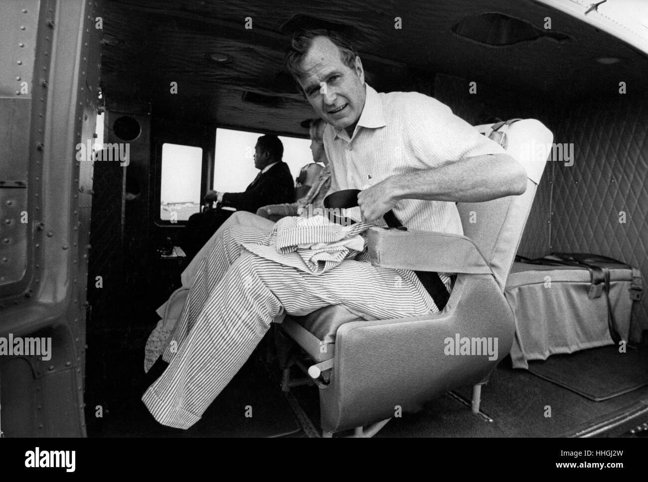 C.I.A. Director George H.W. Bush arrives in Plains, GA via a C.I.A. whitetop UH-1 helicopter to brief President-Elect Jimmy Carter on national security issues. Stock Photo