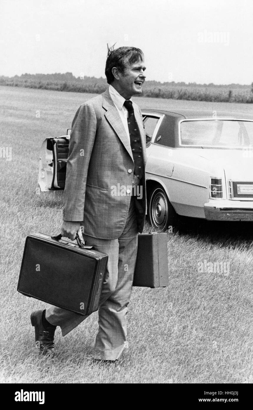 C.I.A. Director George H.W. Bush arrives in Plains, GA via a C.I.A. whitetop UH-1 helicopter to brief President-Elect Jimmy Carter on national security issues. Stock Photo
