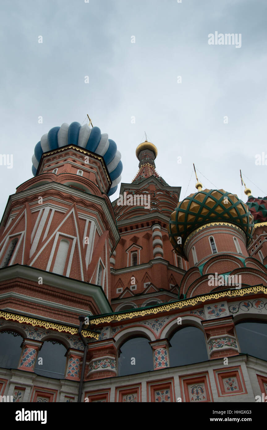 The ornate red brick exterior and colorful onion domes of St. Basil's Cathedral, a Russian Orthodox Church on Red Square. Stock Photo