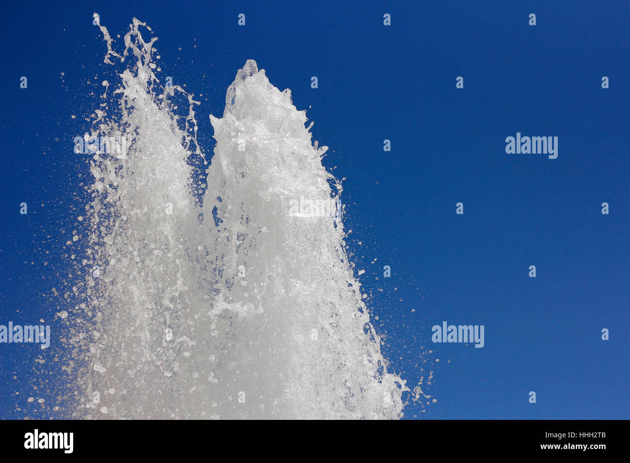 fountain horizontally against a blue sky Stock Photo - Alamy