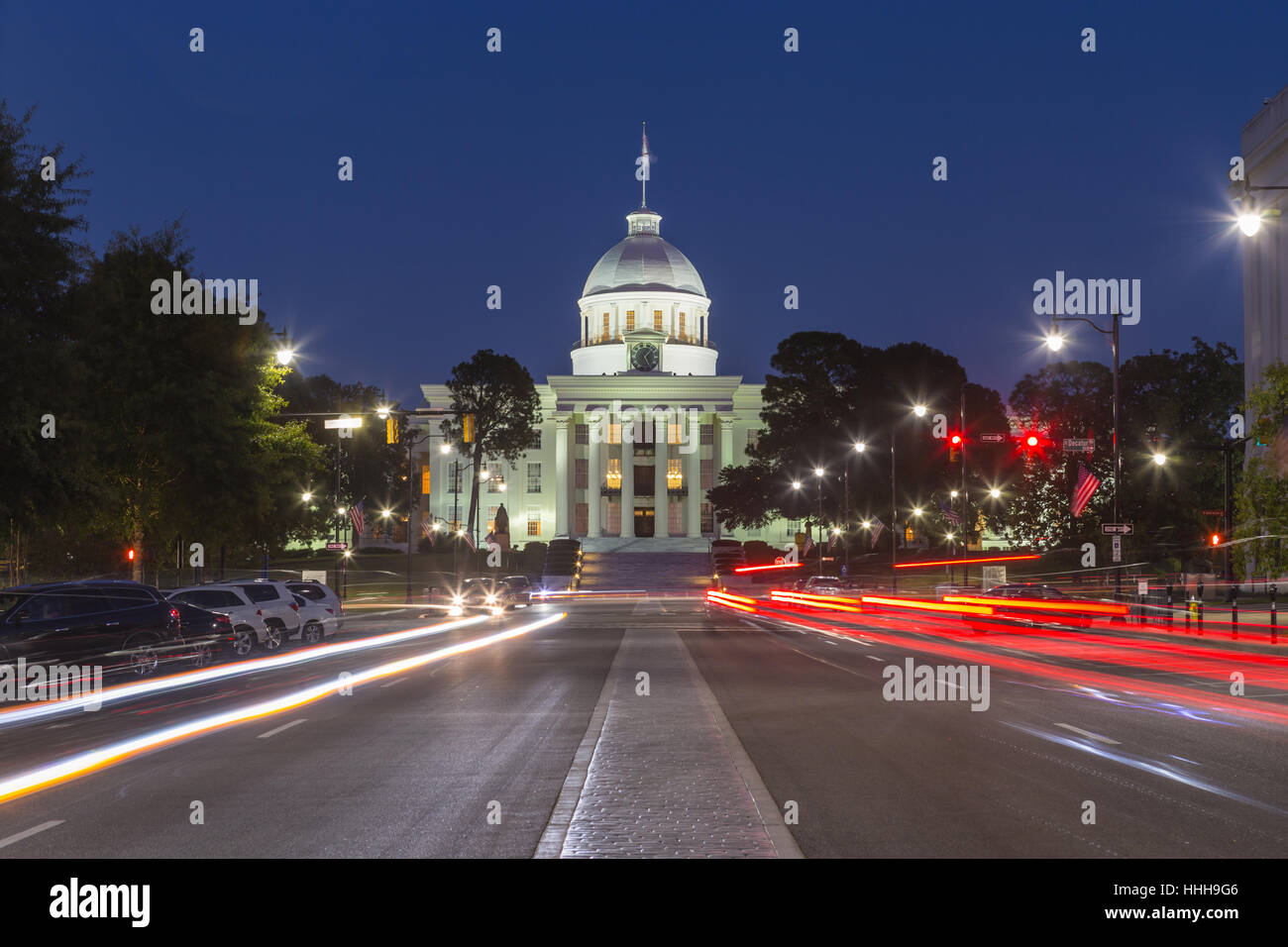 Traffic creates light trails at twilight on Dexter Avenue in front of the Alabama State Capitol in Montgomery, Alabama. Stock Photo