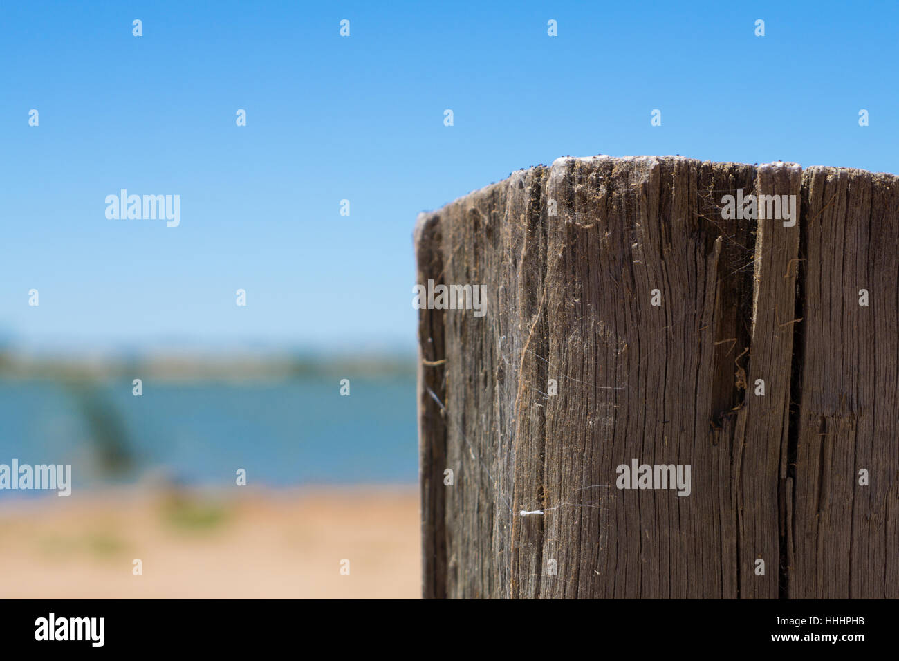 Weathered wooden post at waters edge Stock Photo Alamy