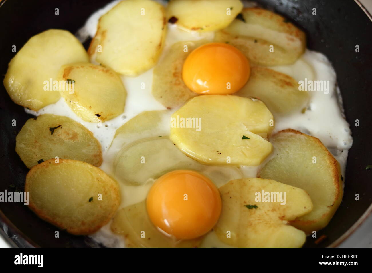 Making Sunny Side Up Eggs With Fried Potato Stock Photo Alamy